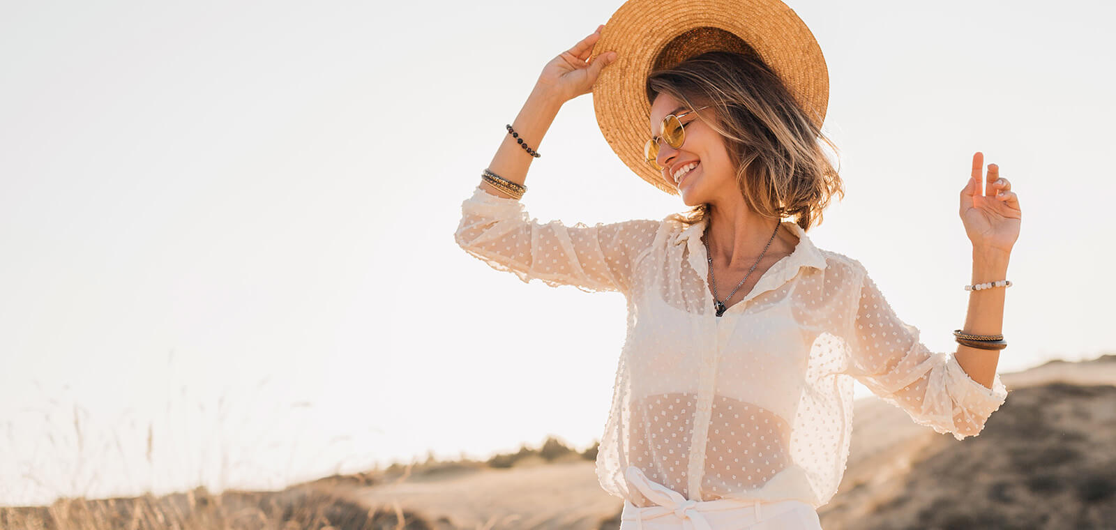Woman in hat at the beach